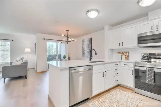 Kitchen open to dining room and look out to the lake view