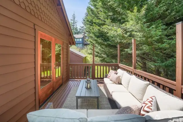 The kitchen eating nook has french doors that open the to huge wrap around deck.