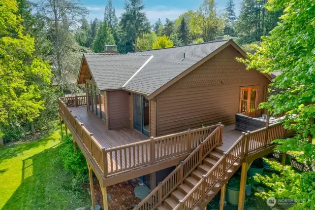 The kitchen eating nook has french doors that open the to huge wrap around deck.