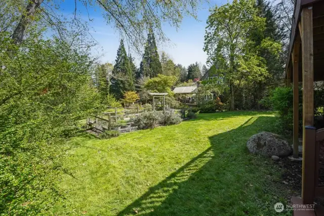 The 0.323 acre lot has two large grass areas and an established, organic garden.