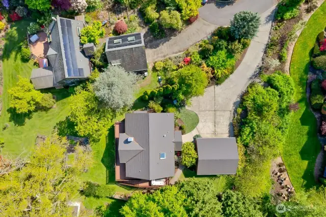 The 0.323 acre lot has two large grass areas and an established, organic garden.