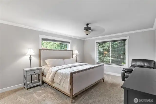 Luxurious primary suite with room to relax and recharge.
