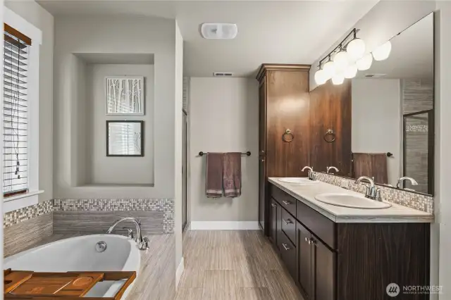 Spa-like ensuite with double vanity, walk-in shower, and premium finishes.
