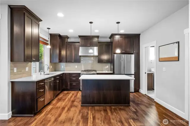Chef’s dream kitchen with sleek finishes, a large island, and loads of counter space.