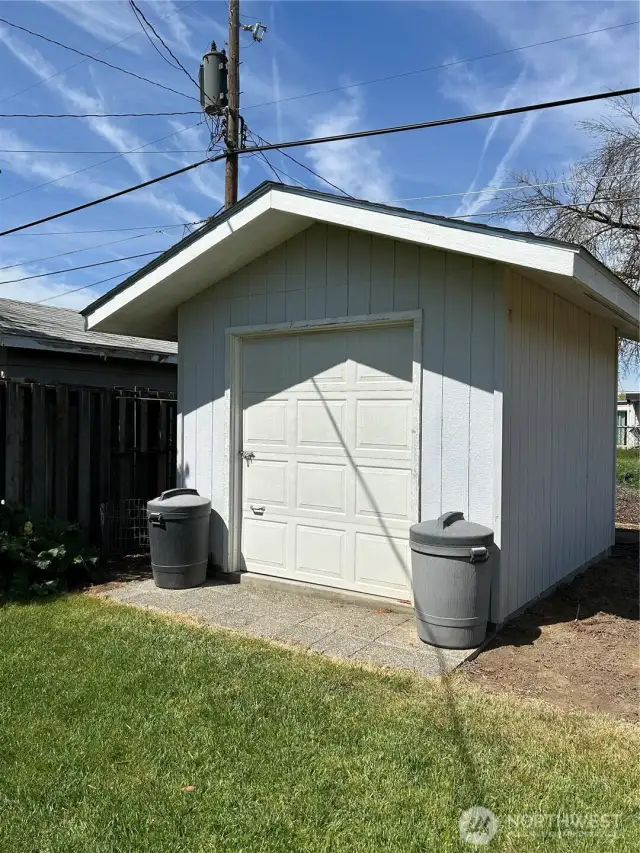 Large garden shed for the mower and tools.