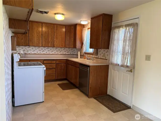 Kitchen with door to the backyard.