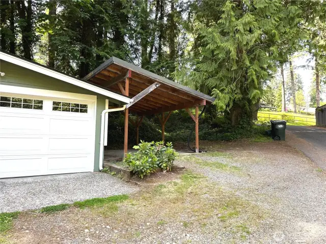 Carport and additional uncovered spot next to the carport.