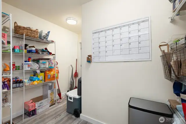 The walk-through pantry offers outstanding storage and quick access between the kitchen and laundry area. Functionality meets convenience.