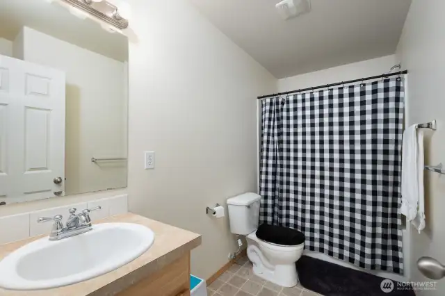 The upstairs hallway full bath includes a shower/tub combo serving the additional bedrooms with ease