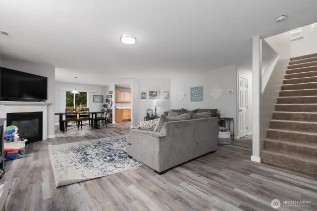 The open concept main level is flooded with natural light and offers seamless flow between spaces.