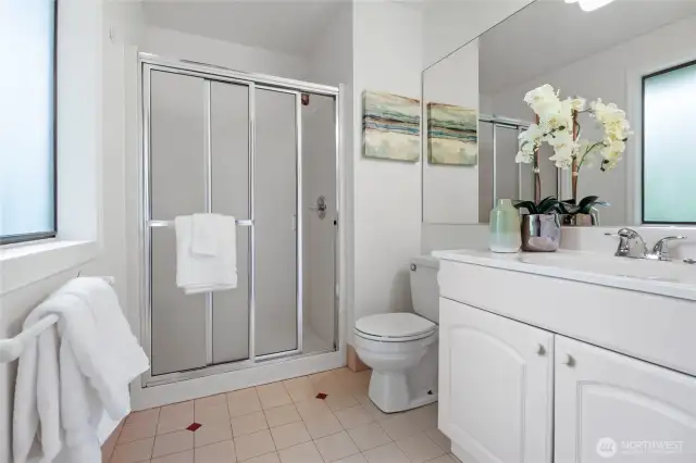 Updated 3/4 bath in the primary bedroom.