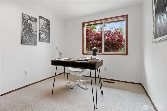 3rd upstairs bedroom is staged as an office with storage closet.