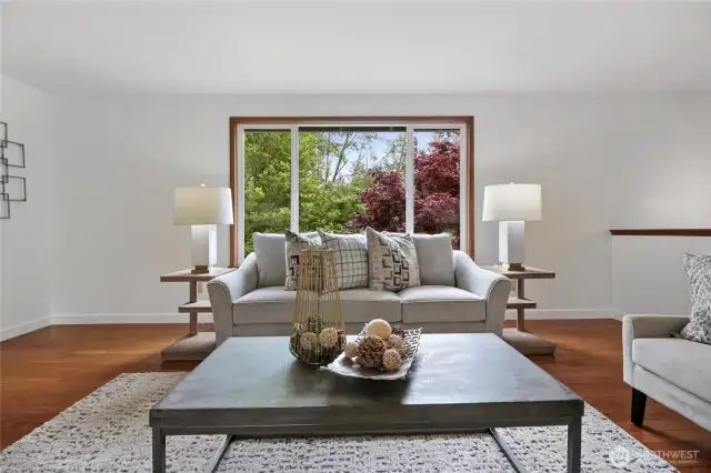 Comfy and cozy family room with new carpeting and a gas fireplace.