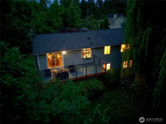Back of the house twilight view of the entertainment decks.