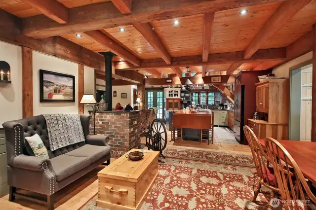 Your back is to the main front doors (Sellers do not use these doors as an entry) and you are looking from the living room into the kitchen. You enter this room from the open doorway seen along the right edge of this photo.