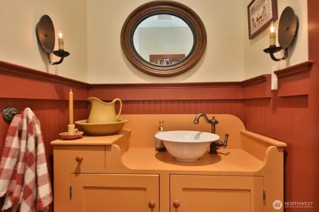 The floors here are consistent with the entry and kitchen, brick pattern tile. The cabinet is a custom Shaker drysink reproduction.  Let's go upstairs where the impeccable craftsmanship continues......
