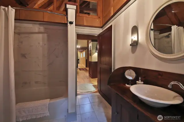 Full bath with porcelain tiled floors.