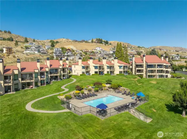 Condo overlooks the hillside swimming pool.