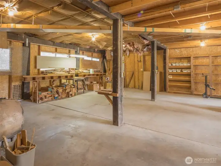 HUGE detached garage/shop with built-in shelving and workbenches.