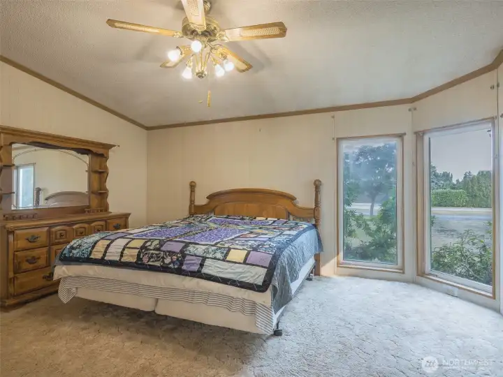 Spacious enough to comfortably accommodate a king-sized bed and additional furnishings.
