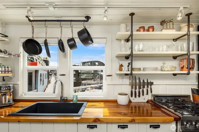 Well designed and fully functional kitchen with deep sink, beautiful countertops and Bertazonni range.