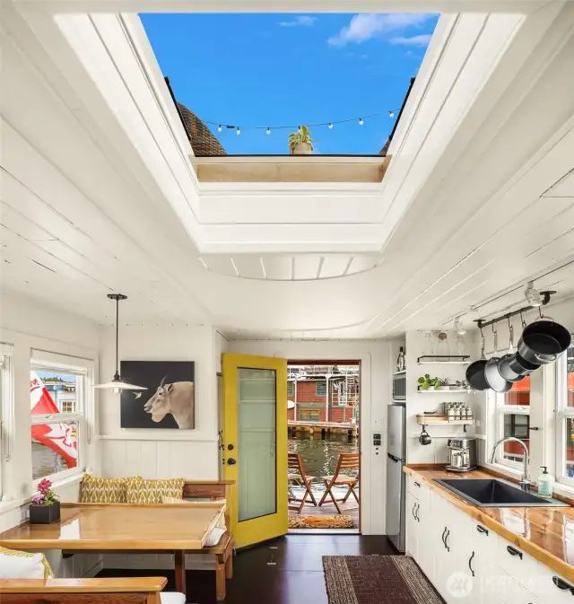 This houseboat is flooded with natural light and located in the perfect slip - with immediate neighbors on only one side.
