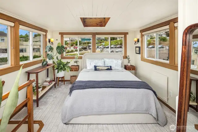 Spacious primary bedroom on second story with new rain detecting skylight (automatically closes) and flooded with natural light.