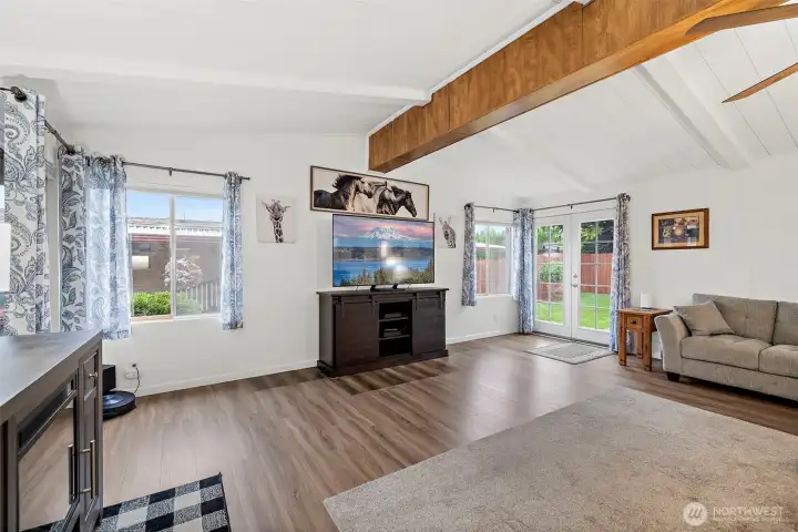 French doors open to nicely landscaped yard