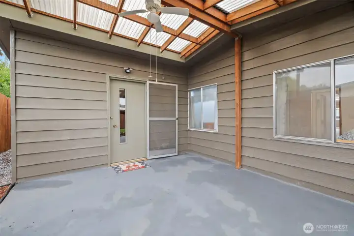 Rear covered patio opens to back yard
