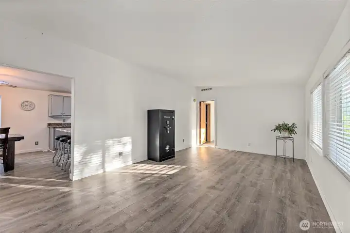 Living room, primary bedroom through door