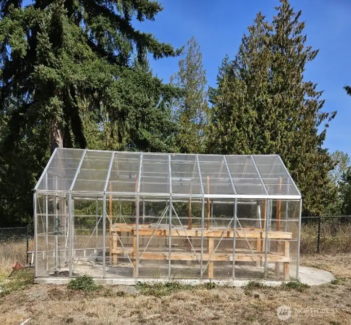 Bring your greenthumb, you won't be disappointed!  Very large garden space directly behind this greenhouse