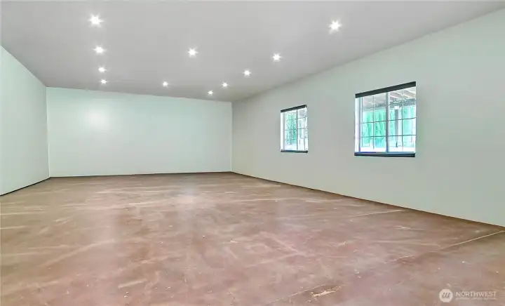 Shop Bay Three view, we used it for a home office, workout area and storage. Has it's own cadet heater. Fully finished, well lit and 3 windows and side door.