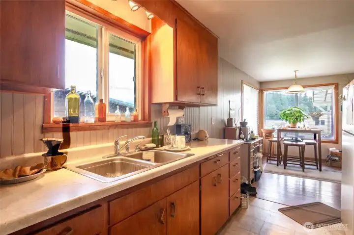 The kitchen opens up to the eating area.