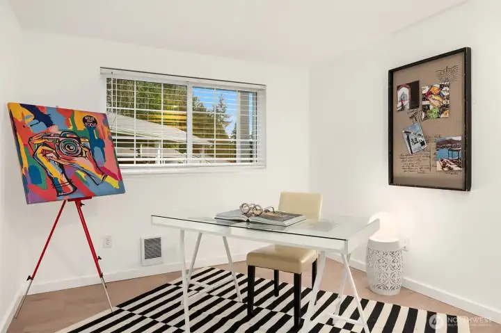 Bedroom staged as office. Bright and convenient.