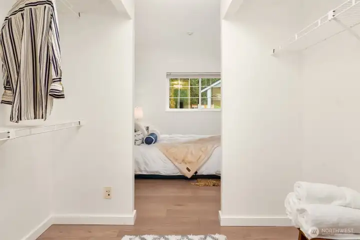 Primary enjoys great light, walk through closets and en-suite bath.