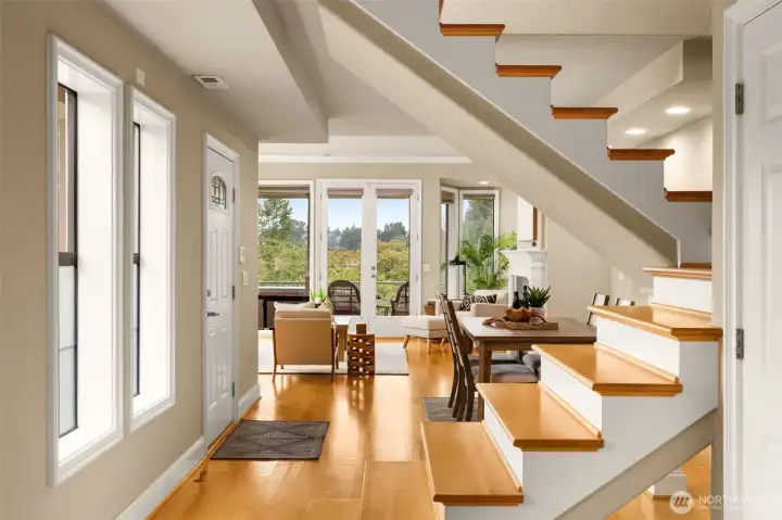 Looking from the kitchen toward the dining area and living room.  (Note - photos were taken before stair railing was installed)