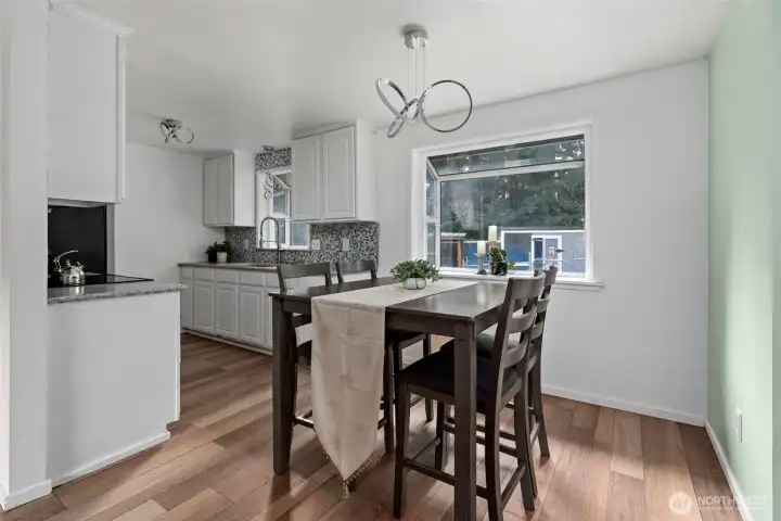 Dining opens to living room and kitchen. All new light fixtures.