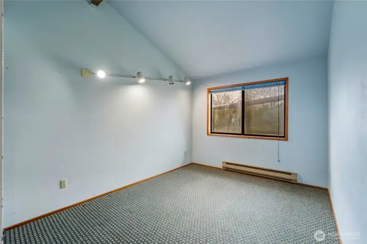 One of three bedrooms upstairs with a gorgeous view of the huge backyard.