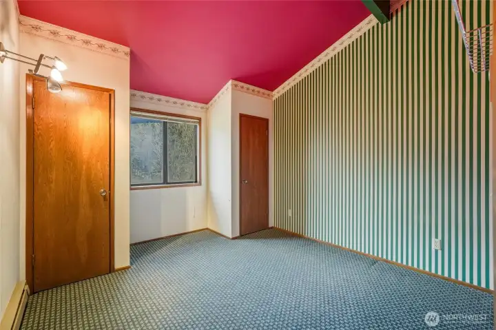 Second bedroom upstairs with an amazing view of the backyard.