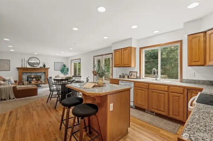 Large kitchen with island opens to family room.