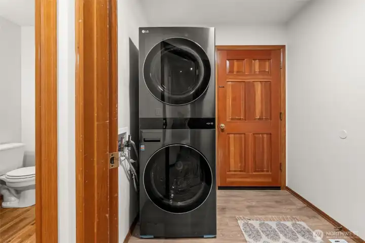 Laundry room leads to garage. Washer and dryer stay with the house.