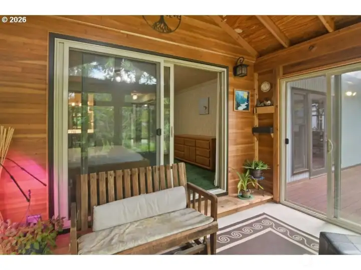 Sunroom attached to primary bedroom with a door to the backyard.