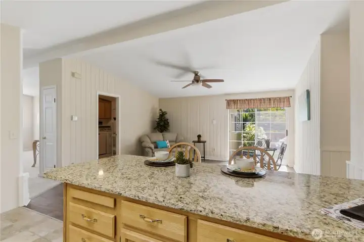The Family Room or Flex Space off of the kitchen has a slider to the side/backyard.