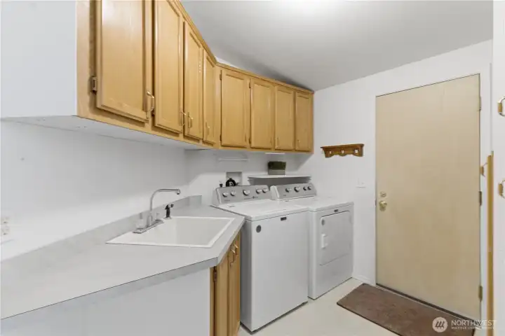It's always so nice to have a utility sink and cupboards in the Laundry Room.