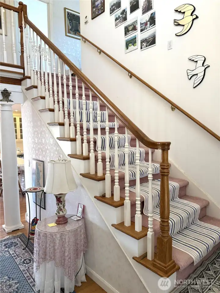 Stairs lead to the two bedroom suites and library/rec room.