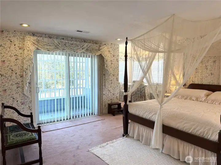 Primary Suite has a private balcony and turret room on the front of the home.