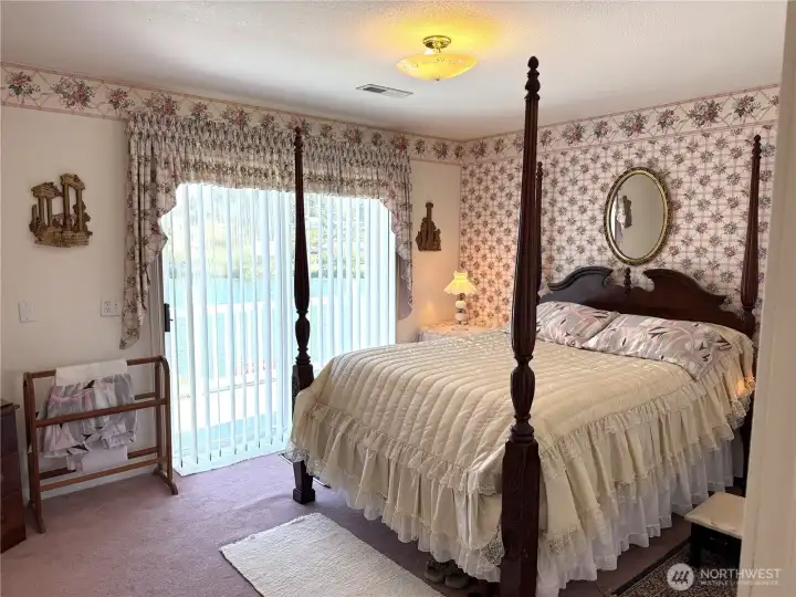 Guest Bedroom Suite with access to the large deck that runs the full length of the house.