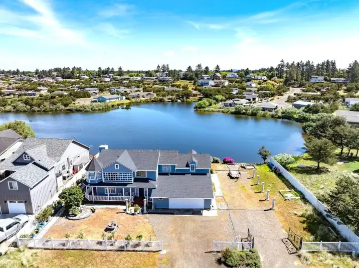 All of this in this New Victorian style home, on the Lake across from the ocean. It is comfort and style at the beach.