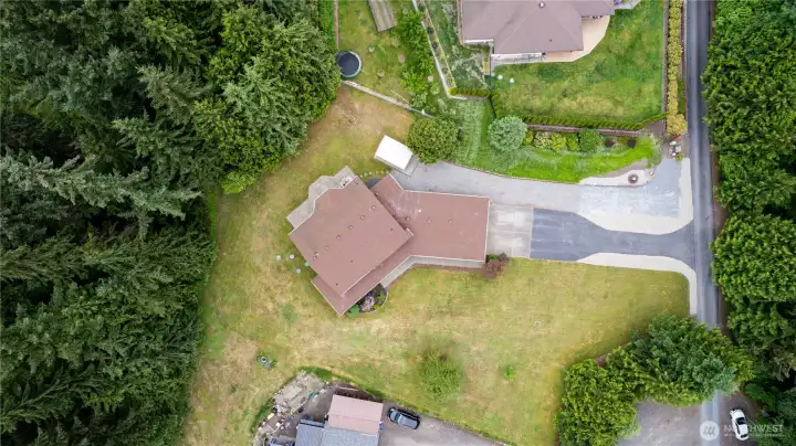 Property extends into the woods (partially fenced), ideal for biking, walking, campfires, or whatever you decide