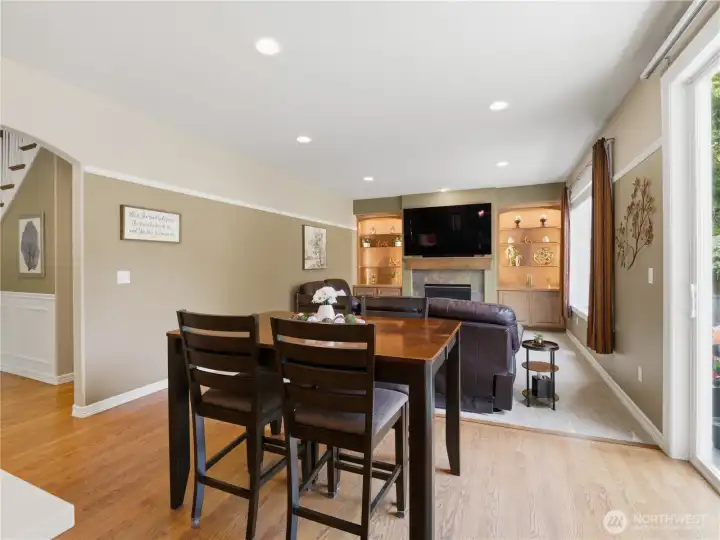 Open-concept room and dining area seamlessly connect to the kitchen, creating an ideal space for everyday living and entertaining.